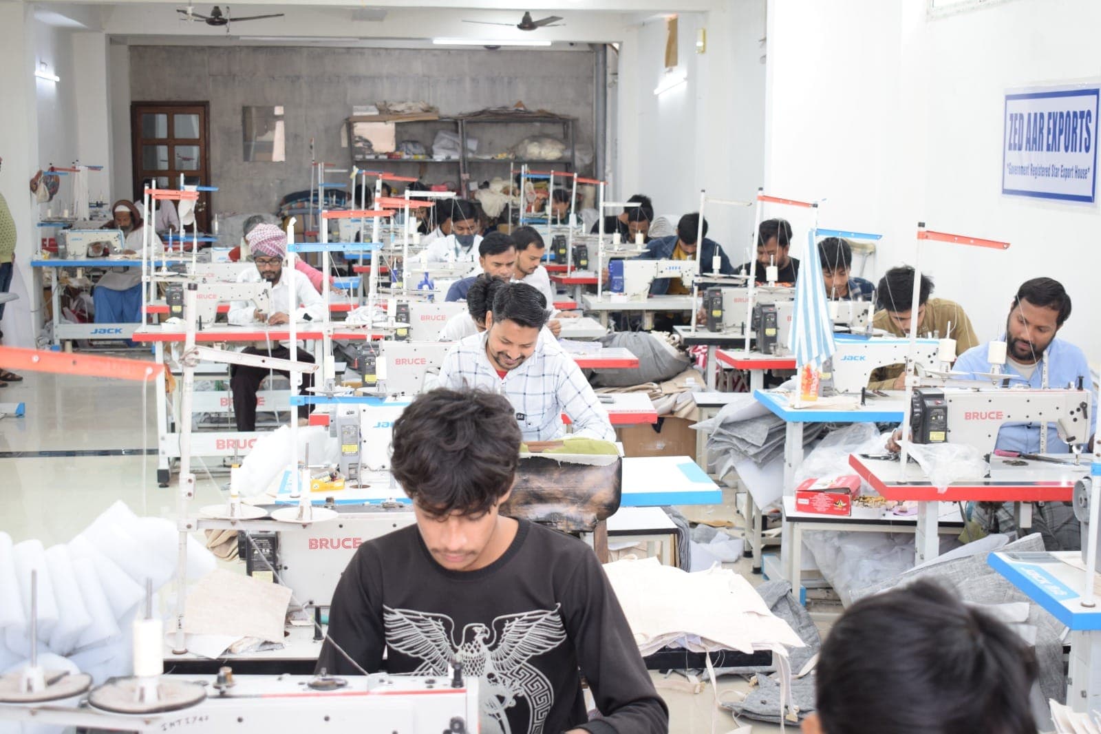 Zed Aar Exports manufacturing floor with industrial sewing stations