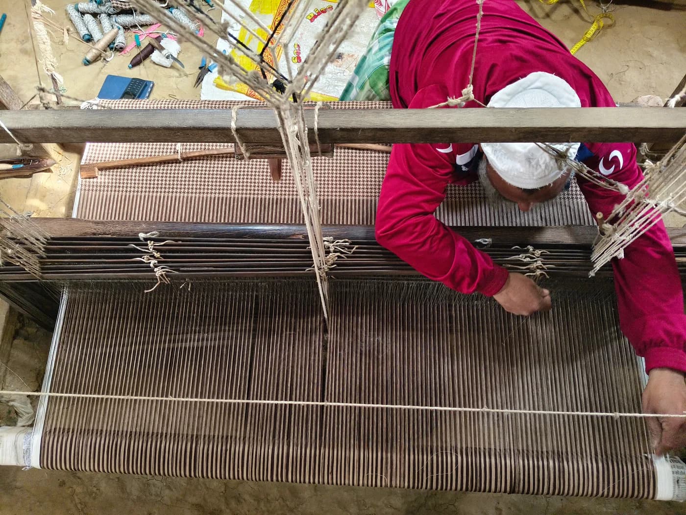 Weavers at handlooms in a Bhagalpur workshop