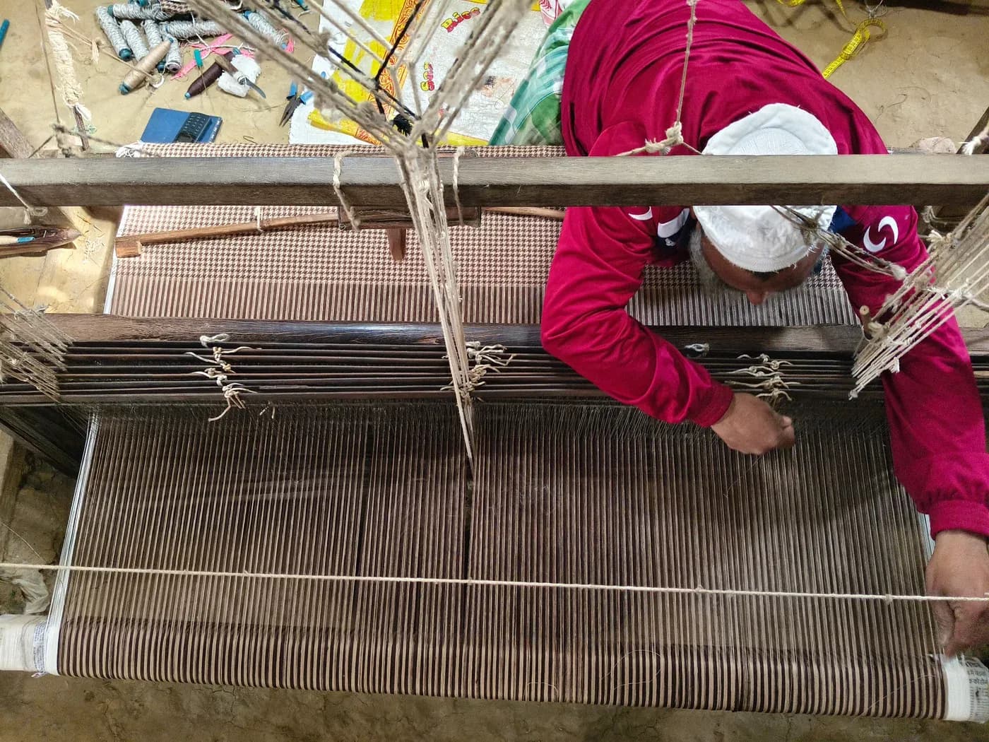 Weavers at handlooms in a Bhagalpur workshop
