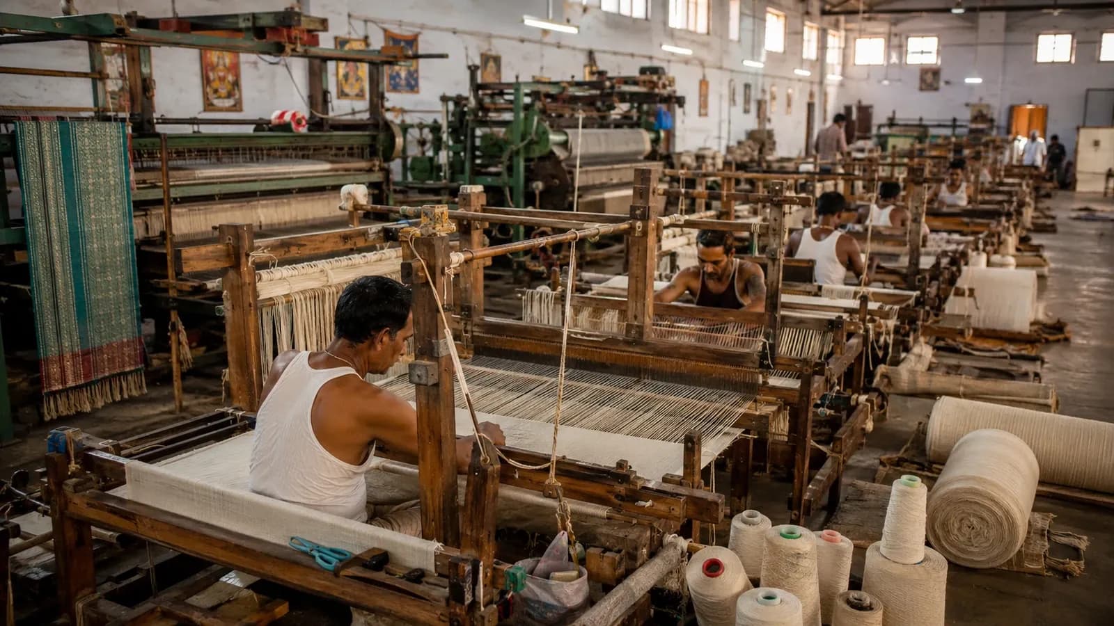 Weaving floor at Zed Aar Exports with looms in operation